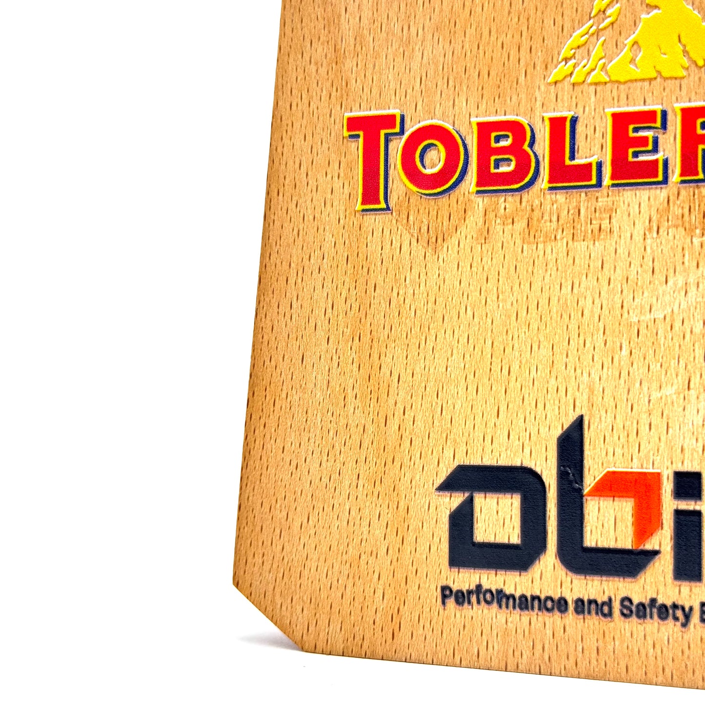 Detailed view of the side panel of a wooden and crystal trophy, highlighting its modern and premium construction.