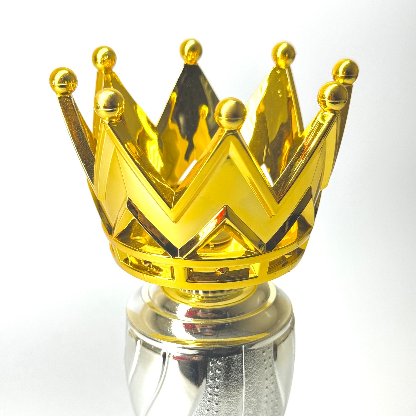 Champion trophy with metallic gold crown, silver neck, and acrylic red base