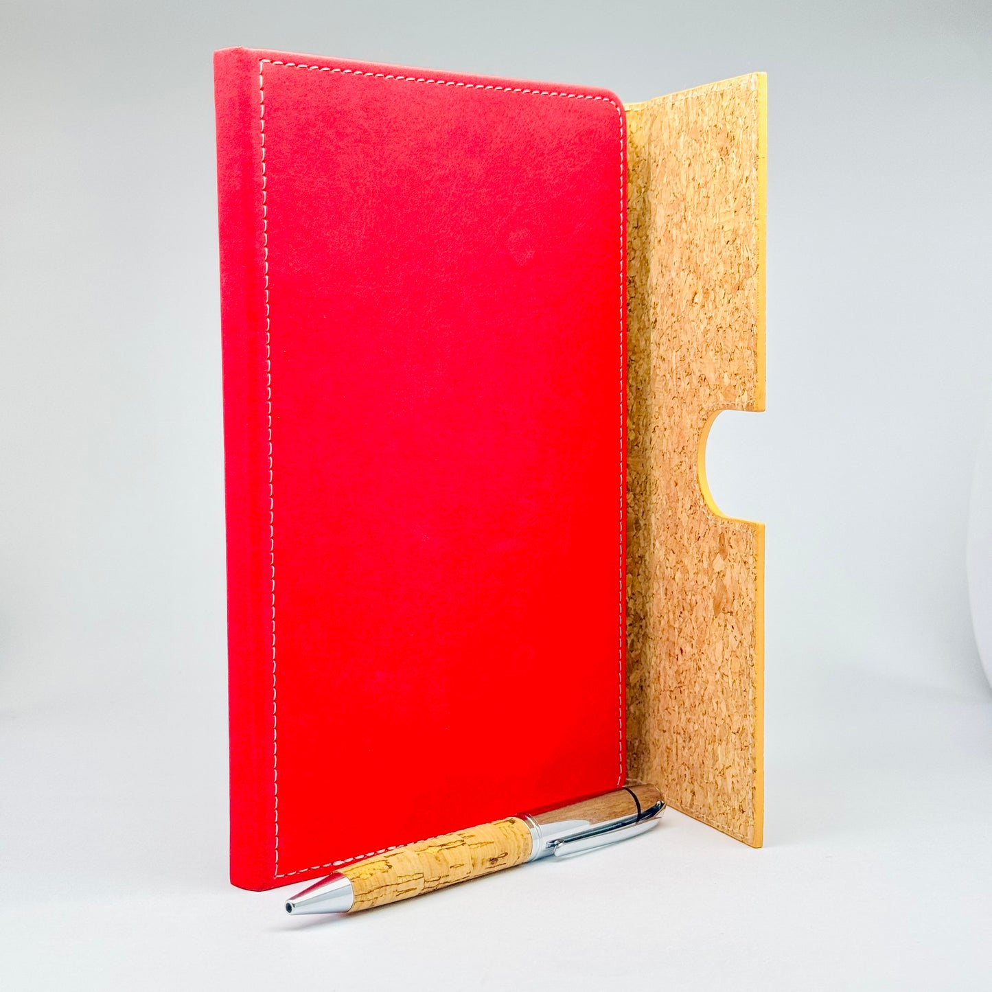 Premium notebook with stitched red and gold design