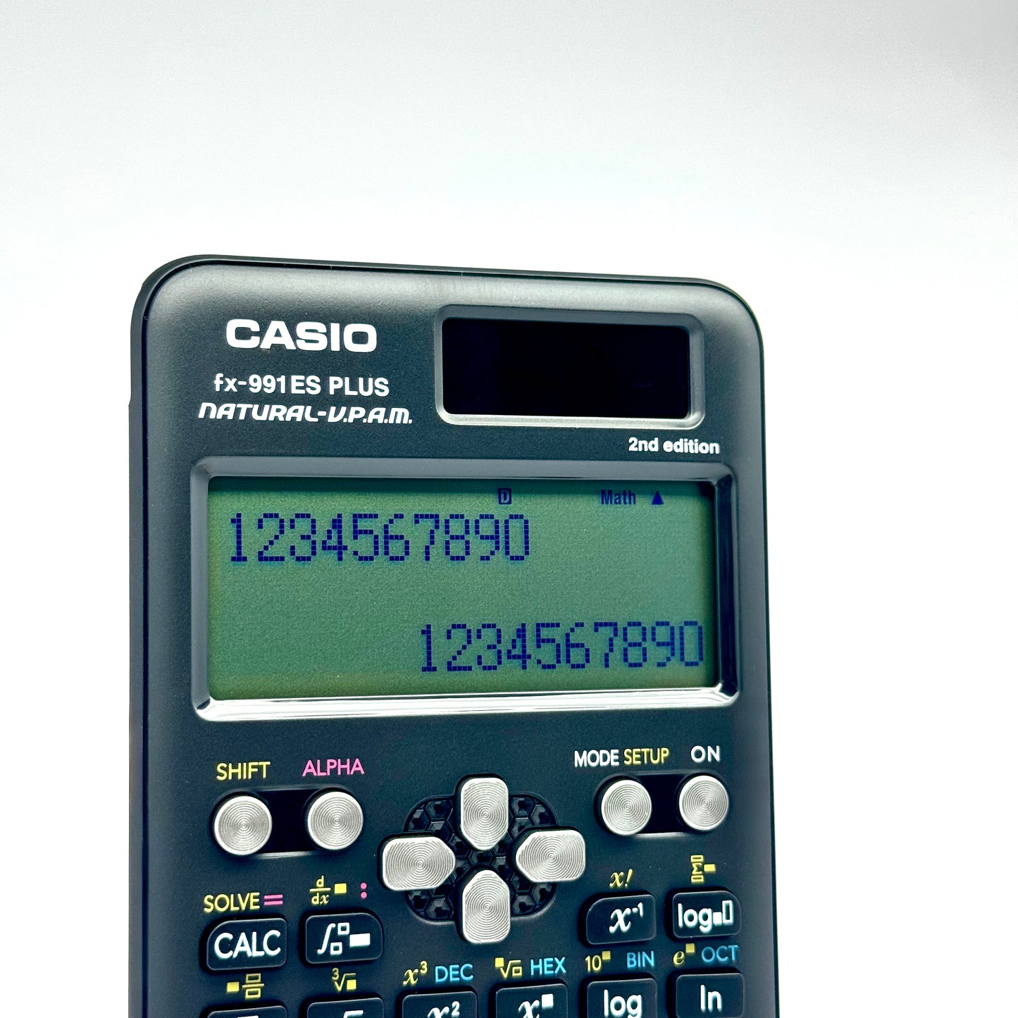 Dark grey scientific calculator showing numbers on LCD screen