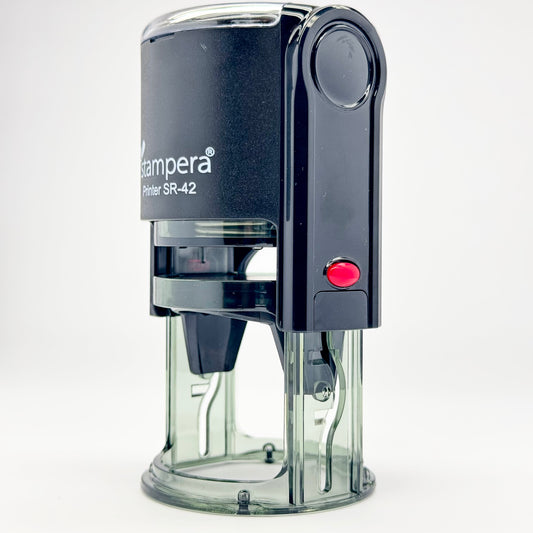 Durable self-inking stamp with transparent base for easy alignment