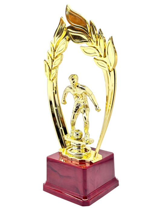Golden football trophy with red marble base and laurel wreath design