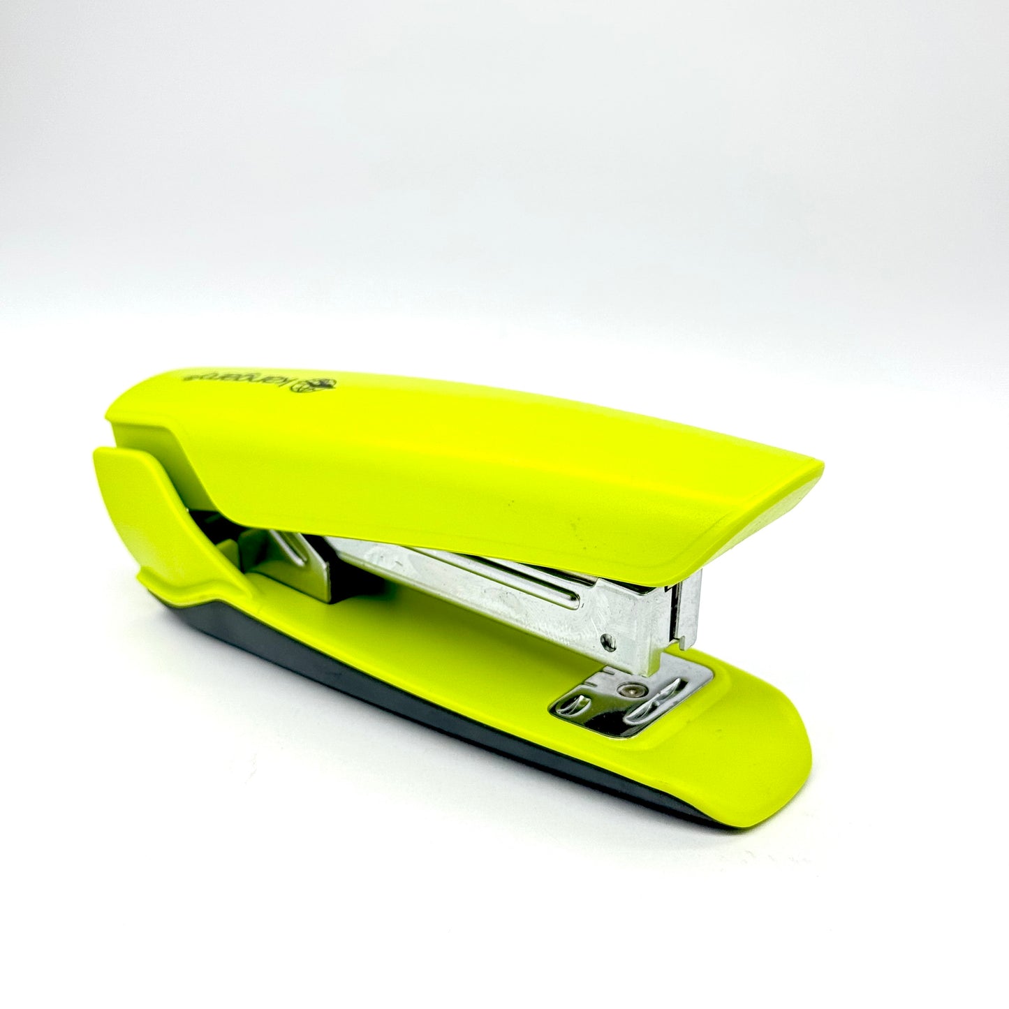 Durable green stapler on white background